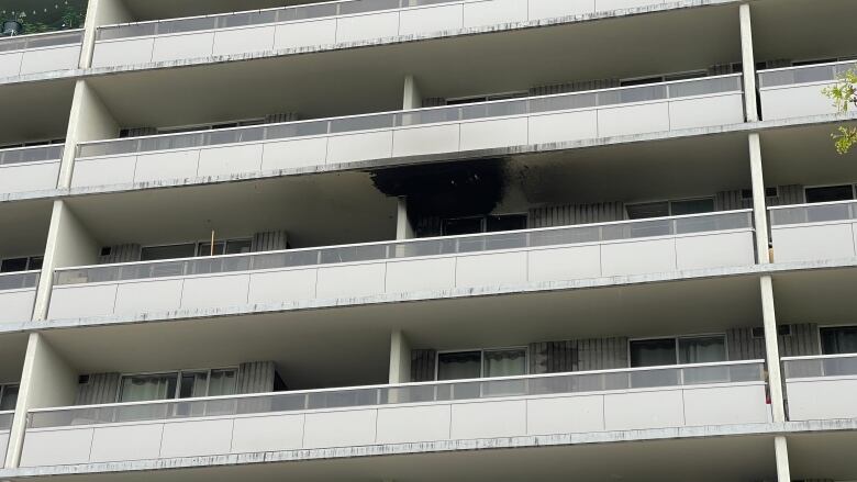 A blackened ceiling can be on the balcony of a unit in a highrise. 