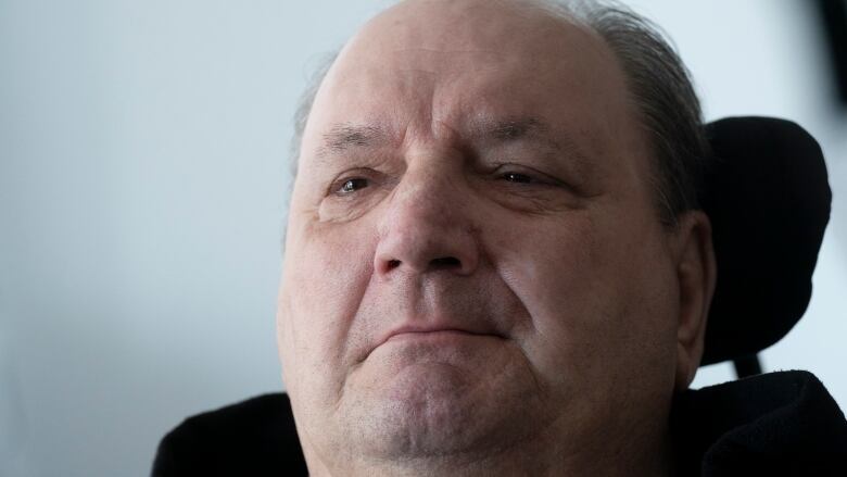 A close up photo of a man's face