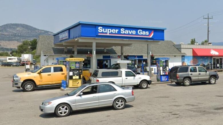 A gas station with the blue banner reading 'Super Save Gas'.