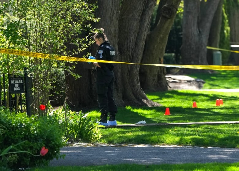 Toronto police at the scene of a shooting outside the gate of Drake's Toronto mega-mansion on May 7, 2024.