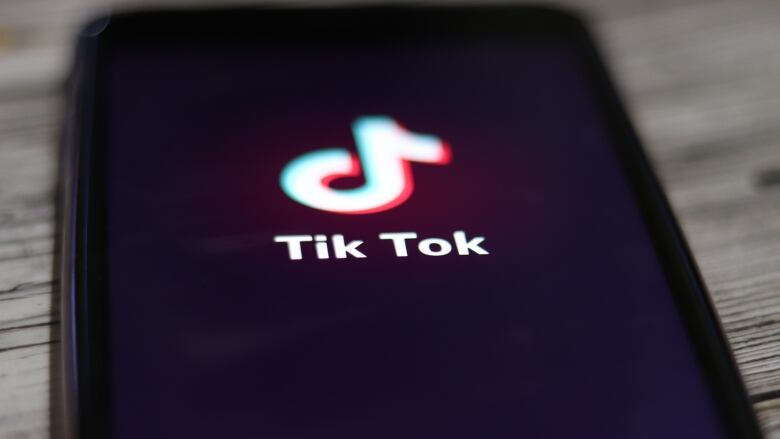 A phone open to the tiktok logo