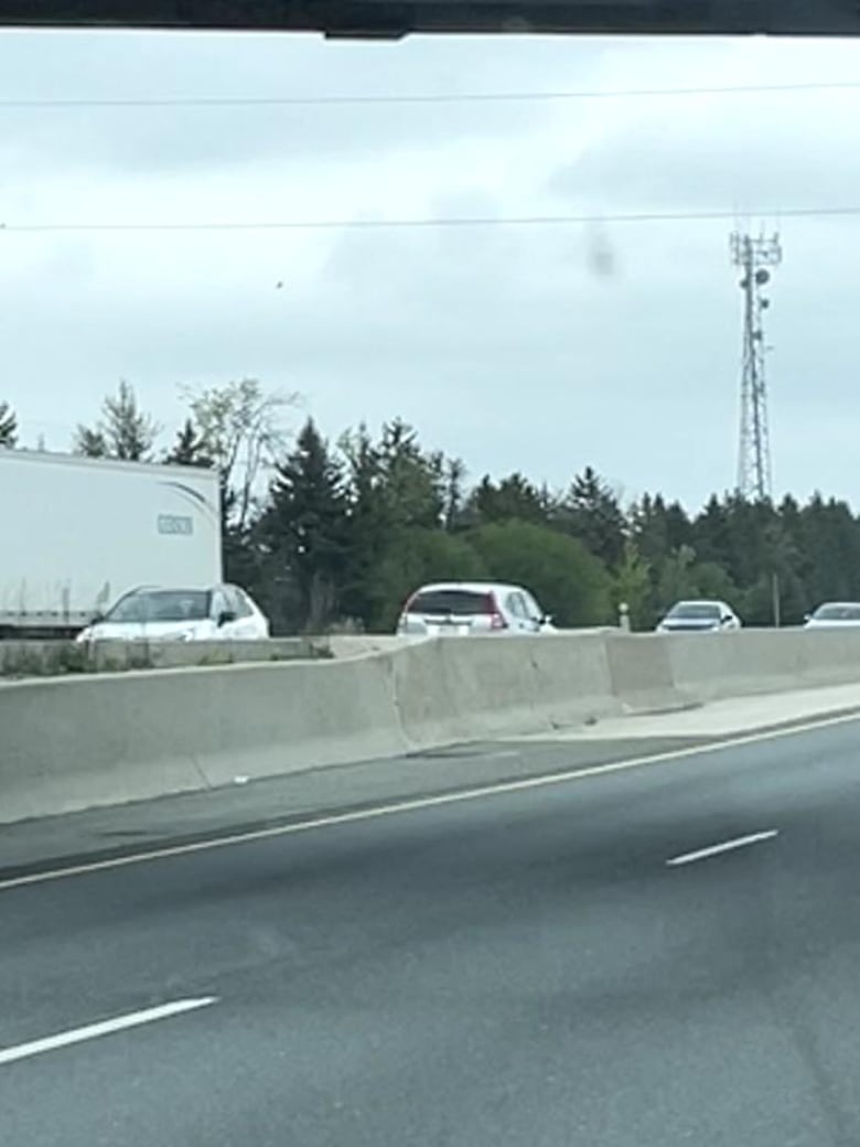 A car driving the wrong way on a highway.