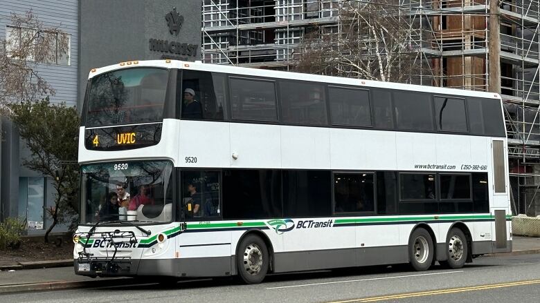 A white double-decker bus with 