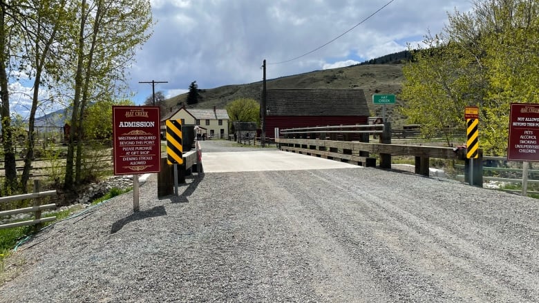 Bridge in front of a older white building