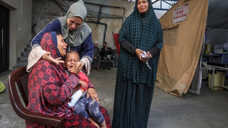 Palestinians mourn their relatives killed in the Israeli bombardment of the Gaza Strip, at a hospital in Rafah, Gaza, Friday, May 10, 2024.