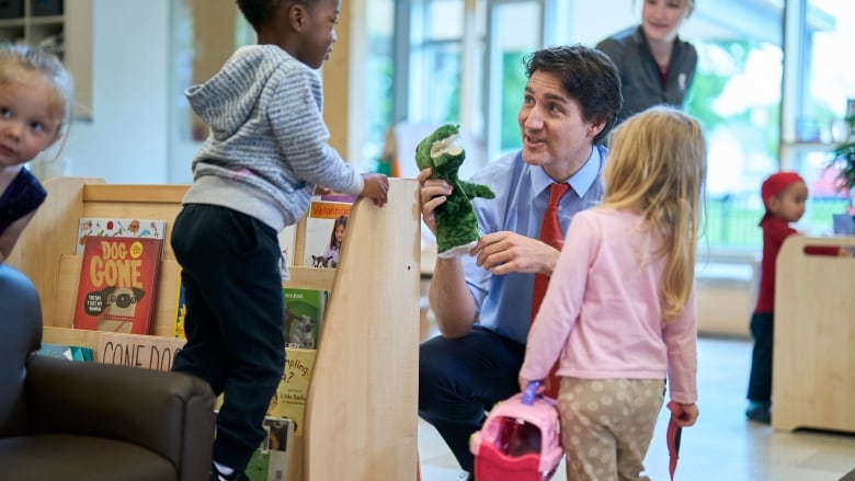 Prime Minister Justin Trudeau speaks with kids at the Stationview YMCA Childcare Centre in St. Thomas, Ont., Monday, May 13, 2024.