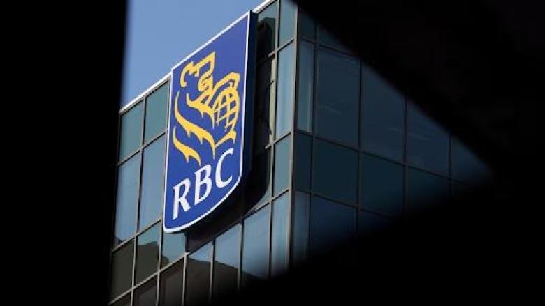 A photo of a large RBC logo on the side of one of its buildings. 