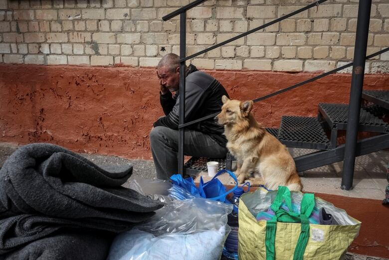 A resident of Vovchansk, Ukraine, is seen after arriving at an evacuation centre in Kharkiv, Ukraine, on Monday.