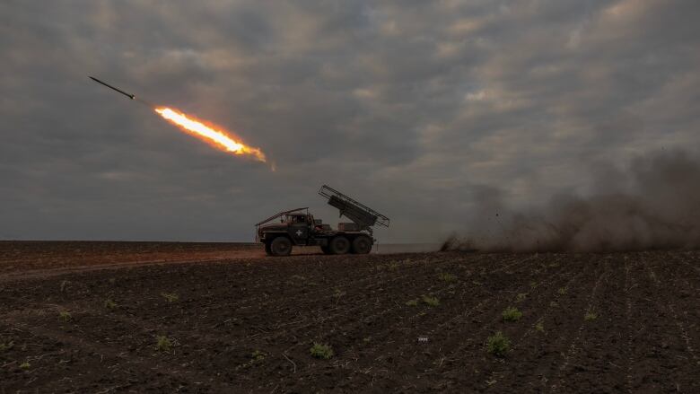 Ukrainian forces use a multiple-rocket launcher to fire toward Russian positions in the Kharkiv region on Wednesday.