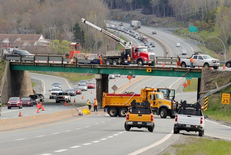 construction workers on an overpass