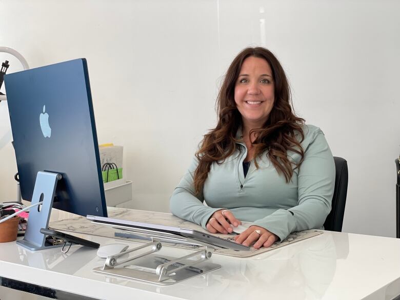 Tiffany Gallivan at desk with computer