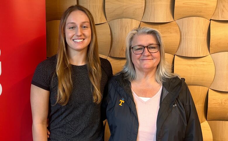 Two women smiling at the camera