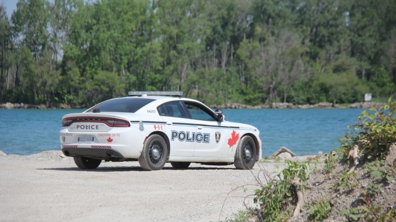 Windsor police cruiser is parked in the area where two students went missing at Sandpoint Beach.