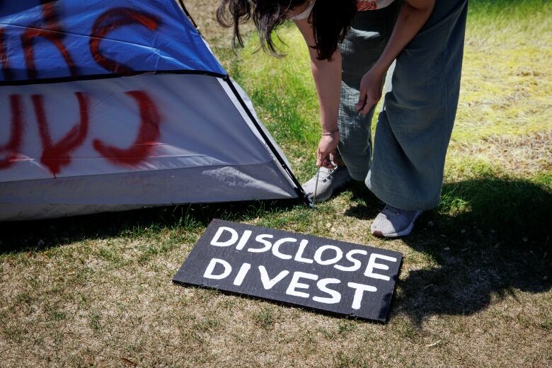 Occupants of a pro-Palestinian encampment on the main campus of the University of Toronto relocate tents on May 24, 2024.