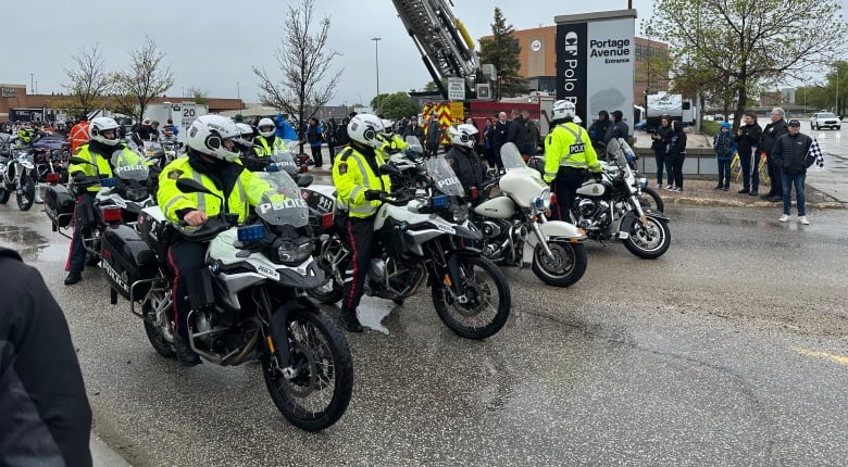 A group of police motorcyclists are pictured.