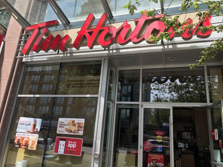 A coffee shop with the words 'Tim Hortons' above it.