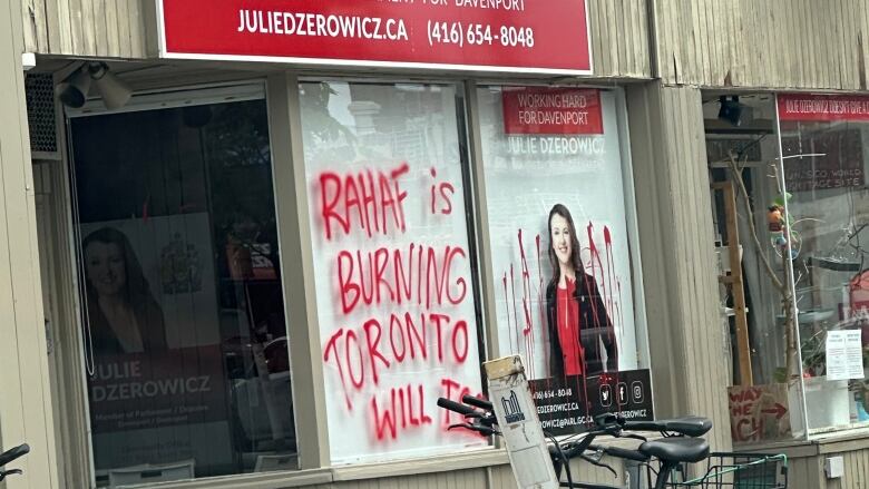 Paint covers the windows at a Toronto MP's constituency office.