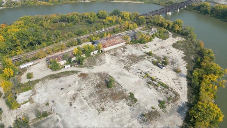 Aerial view of an old industrial site near a river