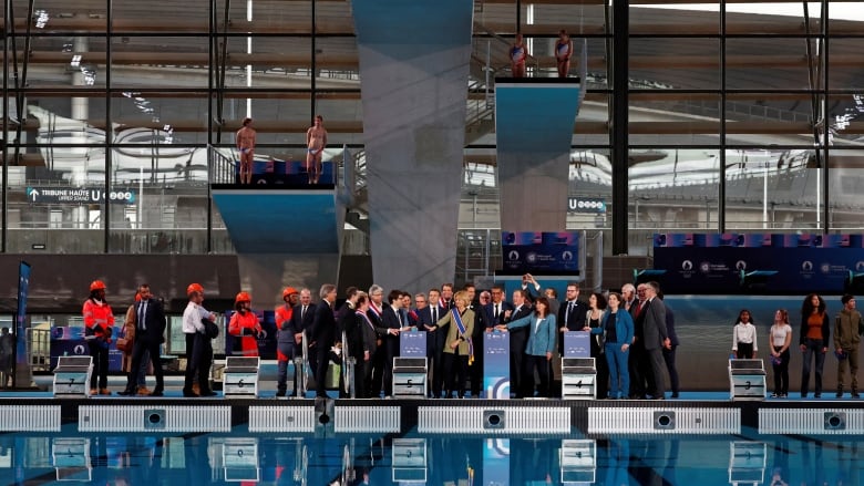 People gather at a pool for an inauguration event