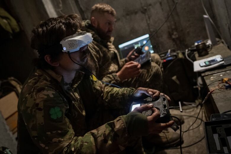 A Ukrainian serviceman of the attack drones battalion of the Achilles, 92nd brigade, operates a drone at his front line position, amid Russia's attack on Ukraine, near a Russian border in a Kharkiv region, Ukraine May 15, 2024. 