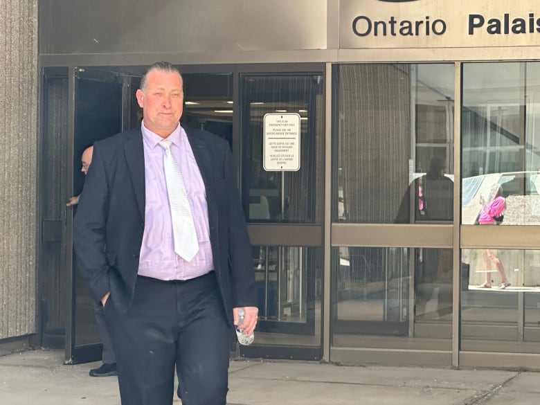 Former Woodstock mayor Trevor Birtch leaves court on Thursday, May 30. 