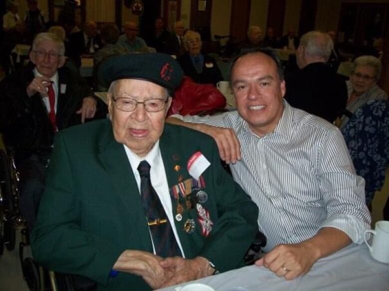 Late Peepeekisis Cree Nation veteran Charles Bird sits with his son, Nelson. the families of Bird and other Regian Rifles veterans are in France this week for ceremonies marking the 80th anniversary of D-Day.