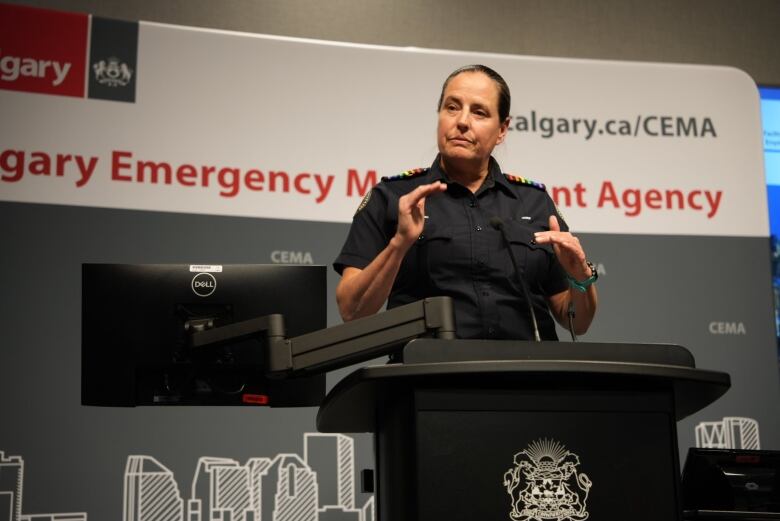 a woman in a uniform standing at a podium