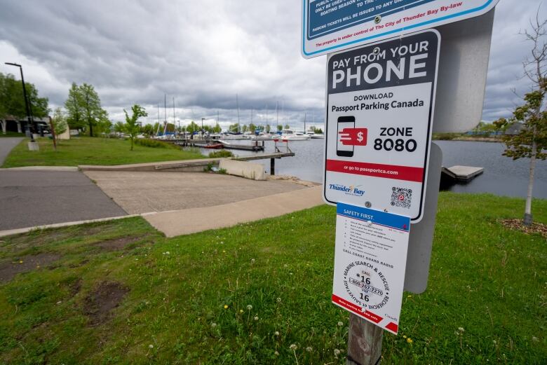 A close-up of a parking sign is seen at a marina.