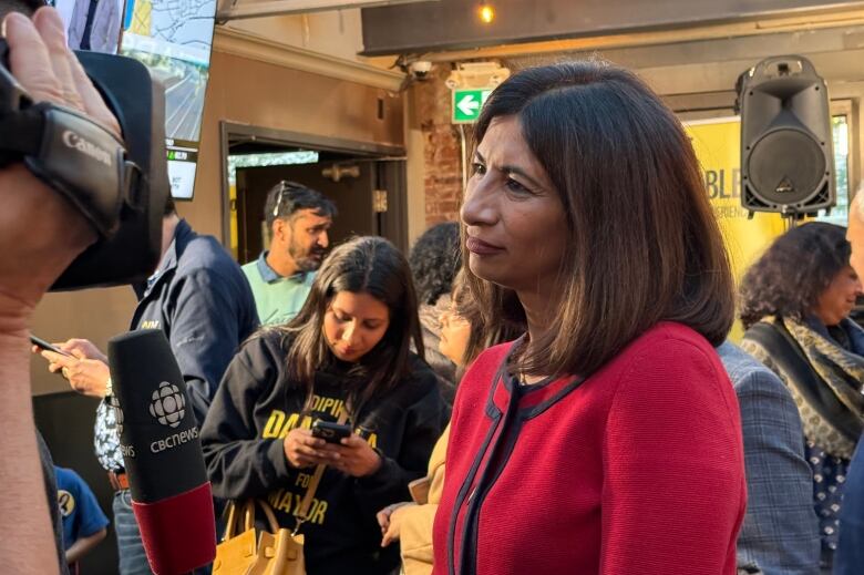 Mississauga mayoral candidate Dipika Damerla speaks with reporters following the mayoral byelection. 