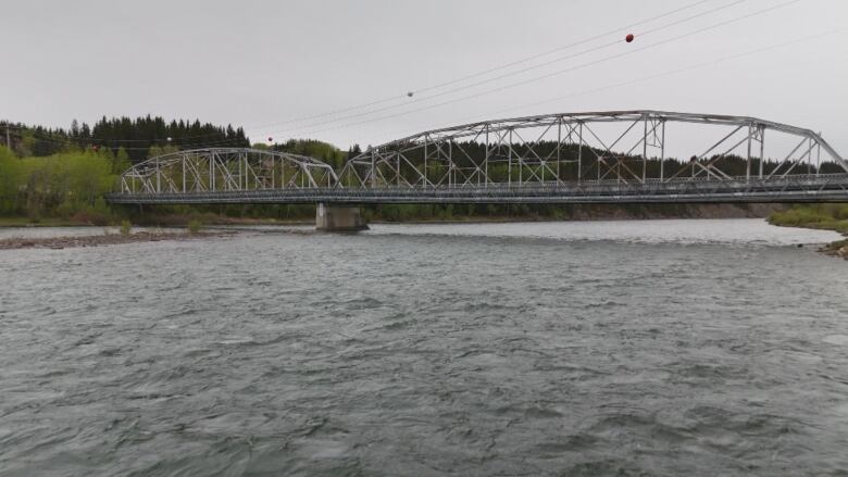 A bridge over water is pictured.