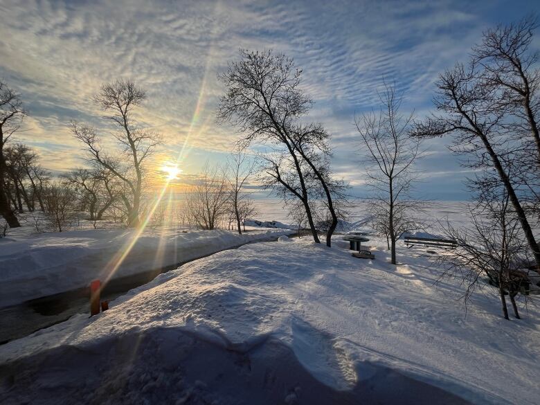 Sun is setting over a frozen lake