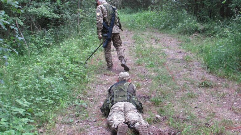 Ukrainian soldiers practice searching for IEDs under the watchful eye of Canadian trainers in southwest Poland on Monday, June 19, 2023.