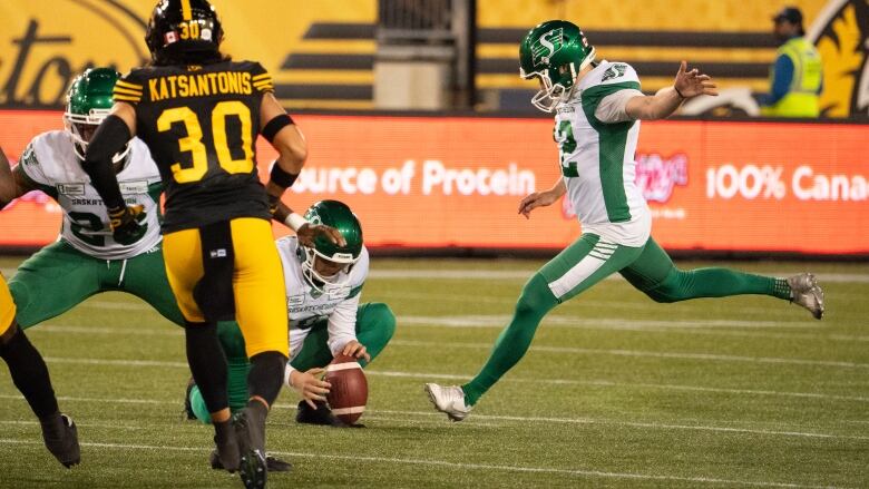 Saskatchewan Roughriders kicker Brett Lauther (12) kicks the game-winning field goal during second half CFL football action against the Hamilton Tiger-Cats in Hamilton, Ont., Sunday, June 16, 2024. 