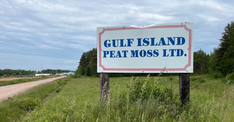 A roadside sign reads Gulf Island Peat Moss.