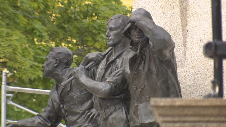 three statues at the war memorial in downtown St. John's.