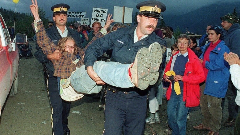 An anti-logging protestor is carried away by RCMP after being arrested for blocking logging trucks at the entrance to Clayoquot Valley, B.C., on July 30, 1993.