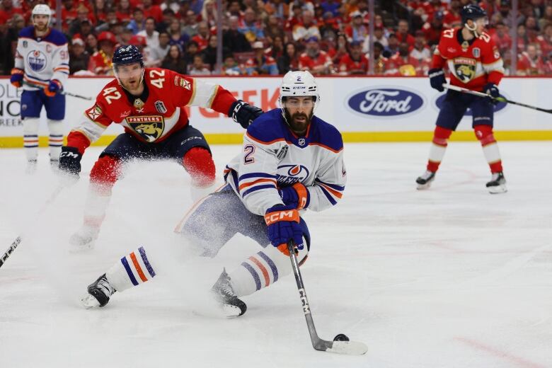 Edmonton Oilers defenceman Evan Bouchard controls the puck during third-period play in Game 5 of the Stanley Cup Finals on Tuesday night.