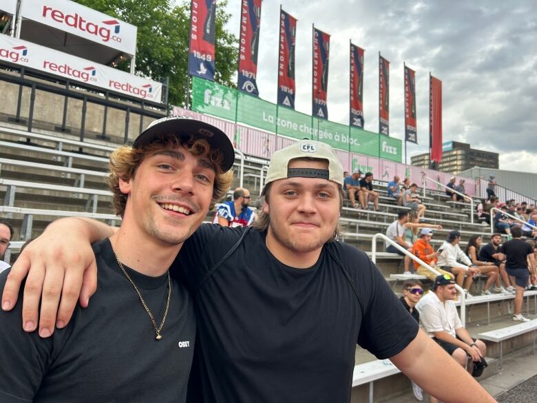 two men smiling at camera