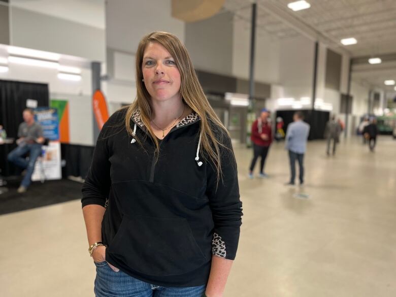 A woman poses for a photo.