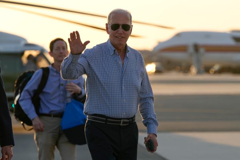 U.S. President Joe Biden is seen waving shortly before boarding Air Force One in Delaware.