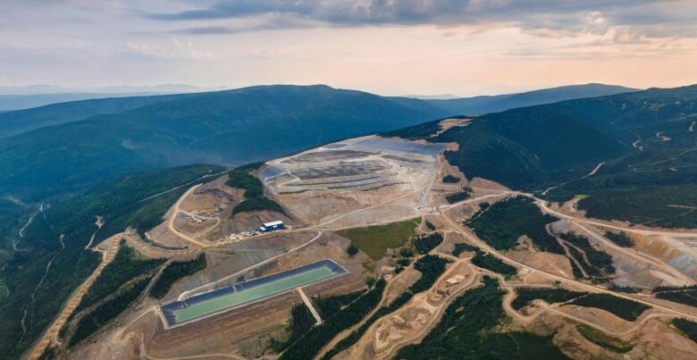 An aerial view of a mine site on a remote hilltop.