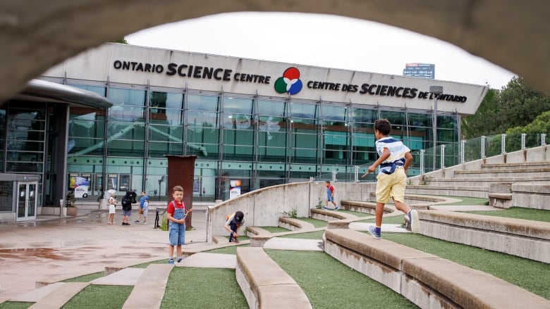 Would-be Science Centre patrons are pictured outside after the attraction was closed due to a risk of roof failure on June 21, 2024.