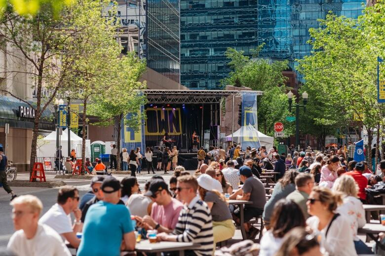 Patrons eating and socializing on Rice Howard Way.