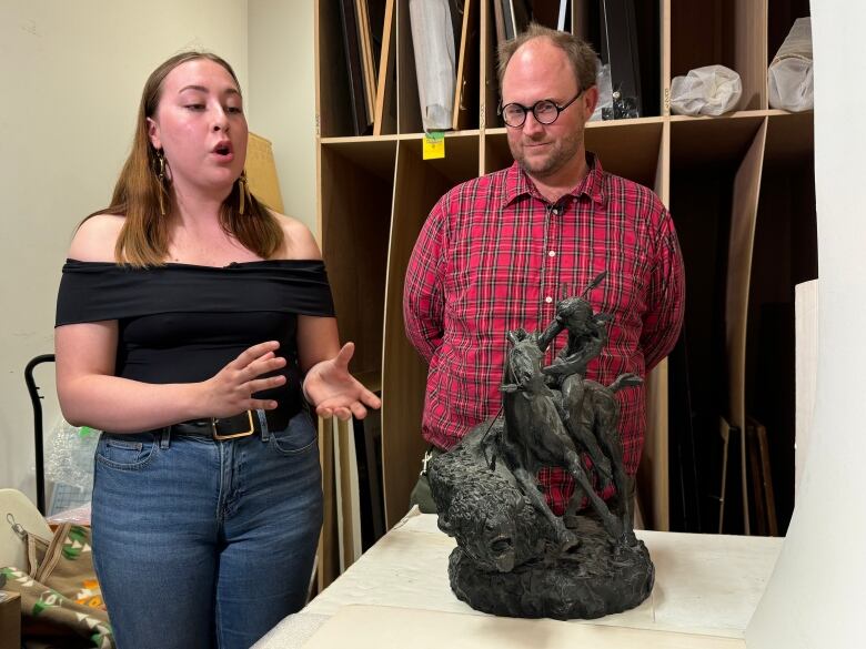 This sculpture of the Buffalo Hunt by American artist, Thomas Holland, is one of the pieces that has been removed from public areas of the University of Manitoba, and relegated to the university collection art vault.