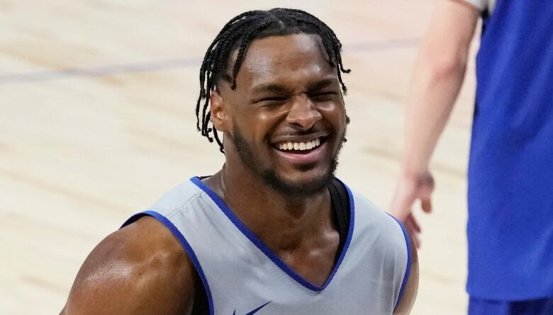 A man holds a basketball