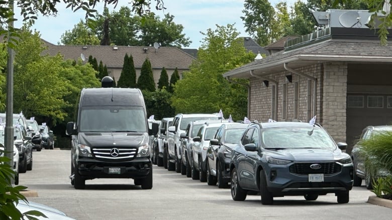 Vehicles at the funeral.