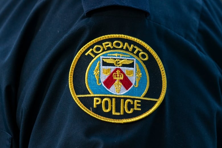 A Toronto Police Service logo patch is shown on an officer's uniform on Sept. 5, 2023.