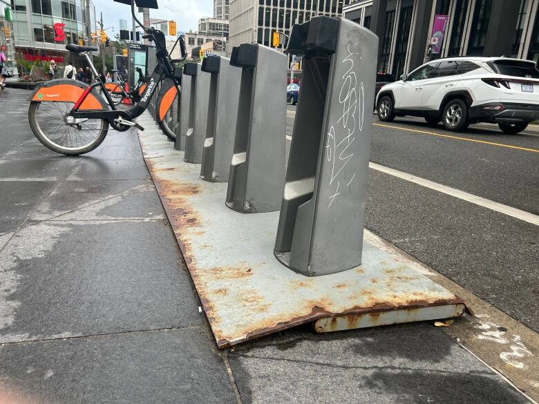 Bike Share Toronto racks riddled with rust near Yonge and St. Clair. Matlow says city staff need to do a better job maintaining street infrastructure.