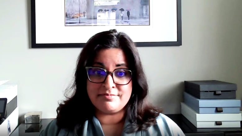 A woman is pictured in an office.