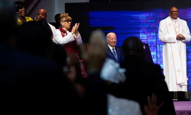 Biden seated in a church